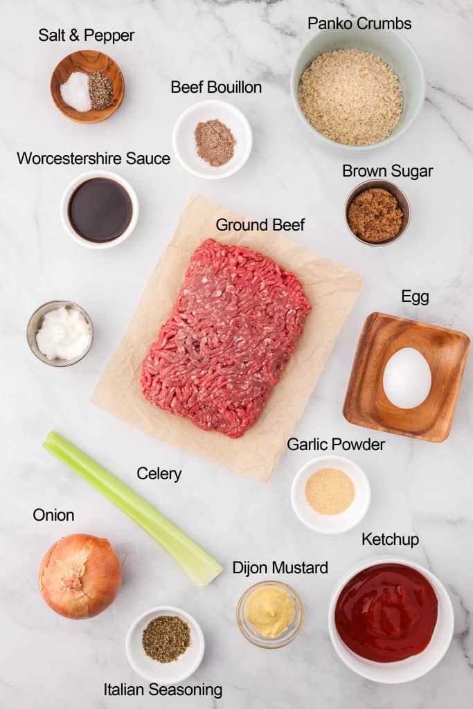 All ingredients for air fryer meatloaf displayed on a marble countertop