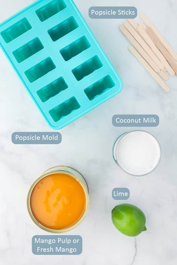 Ingredients for recipe include a popsicle mold, popsicle sticks, mango pulp or mango chunks, coconut milk, and a lime