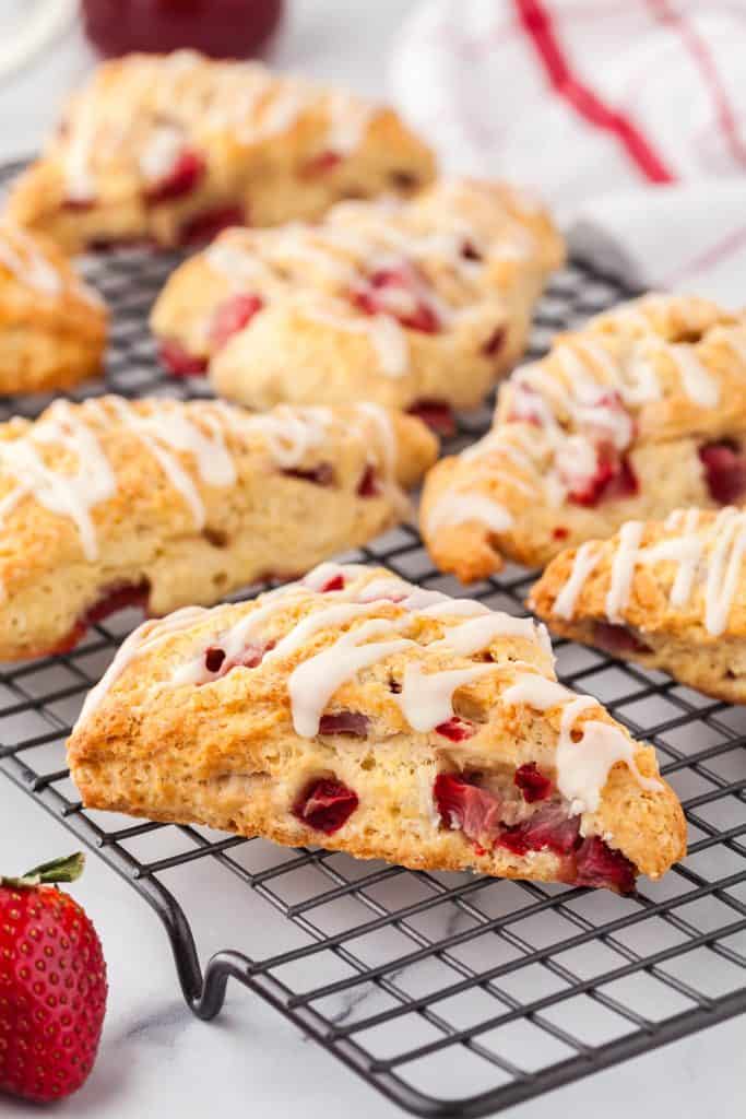 Close up 45 shot of strawberry scones cooling on a cooling rack