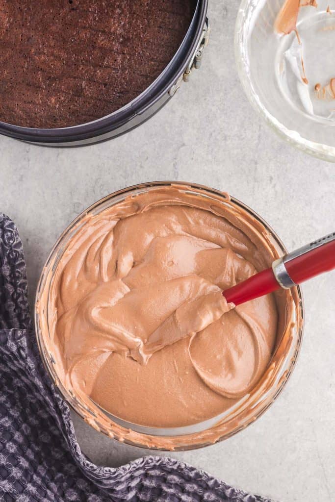 overhead picture of the chocolate mousse ready to be poured overtop of the chocolate cake layer