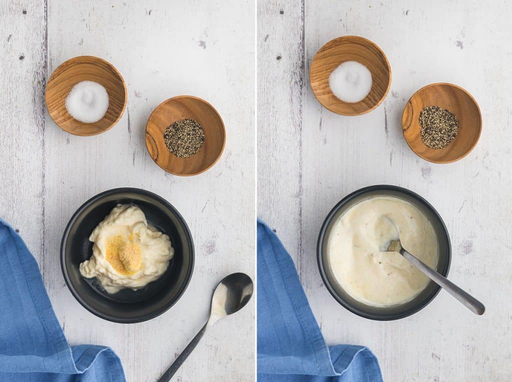 Side by side overhead shot of the garlic aioli being made.  In the picture on the left a small black ceramic bowl is filled with mayonnaise and on top garlic powder and lemon juice have been added.  In the picture on the right salt and pepper have been added and the entire contents of the bowl has been mixed together with a small metal spoon which is still in the bowl.