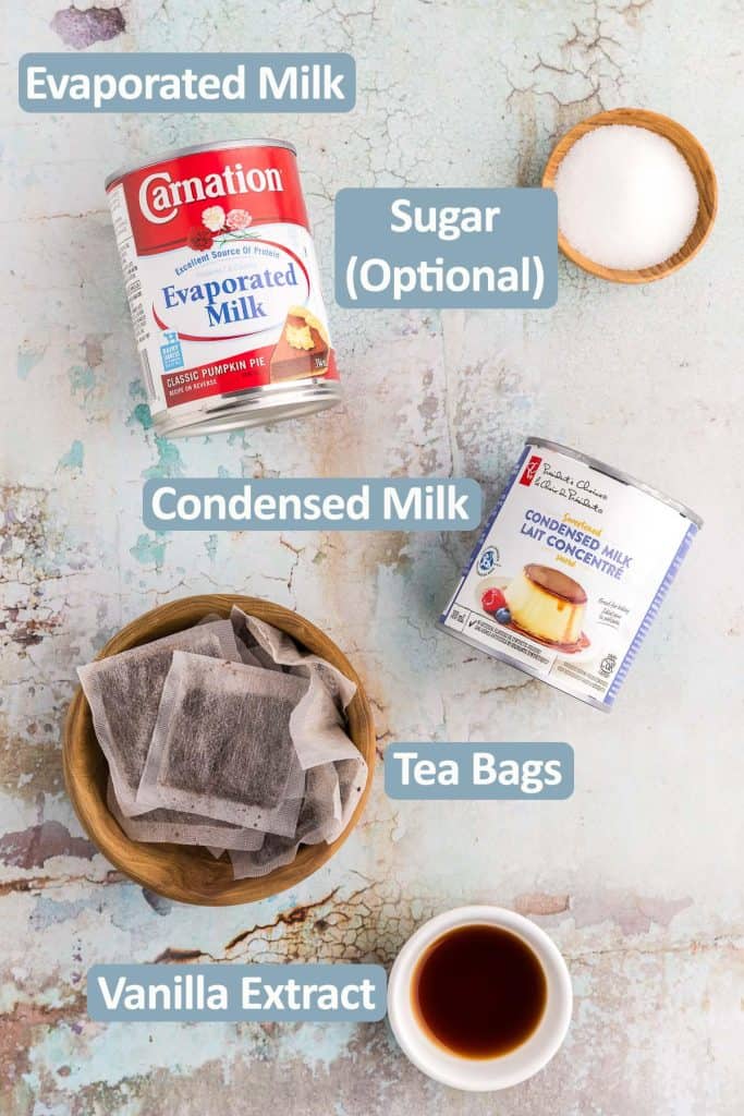 Ingredients needed to make Thai Iced Tea are laid out, Ingredients are: Evaporated milk, condensed milk, tea bags, vanilla extract, and sugar is optional.