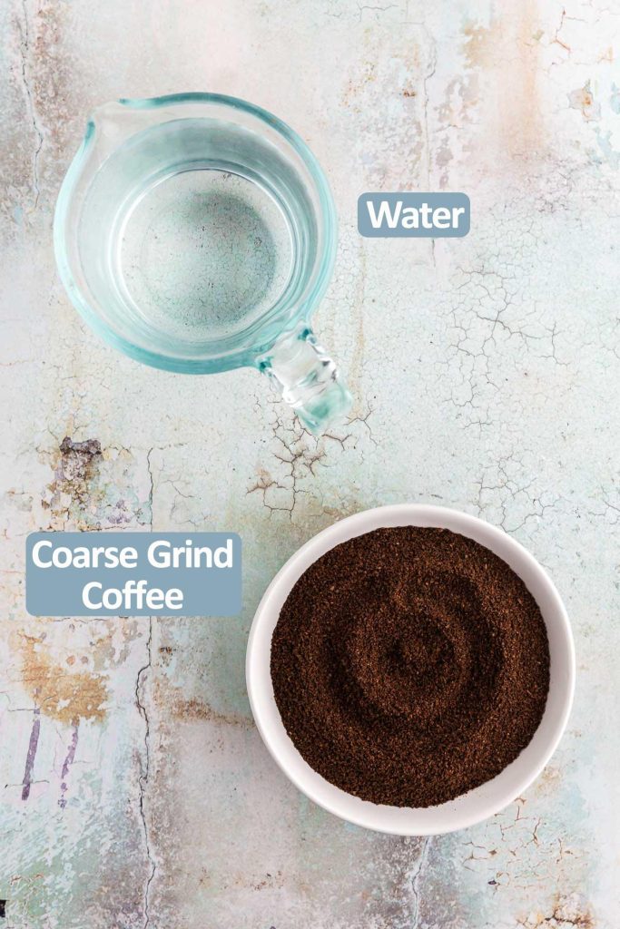 Overhead shot of the ingredients needed to make cold brew concentrate. Ingredients include coarsely ground coffee beans, and cold water.