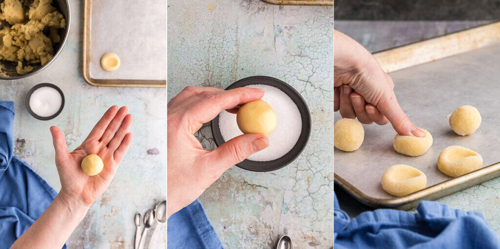 Three side by side photos showing the process of making thumbprint cookies. Picture on the left is of a round ball of the cookie dough resting in the palm of my hand, It is small, about a tablespoon of dough. The middle picture is an overhead close up of the dough ball about to be rolled in a small bowl of sugar. The third picture is a close up side shot of a baking sheet with thumbprint cookies on it, on cookie is currently being pressed down upon to make the thumbprint indent.