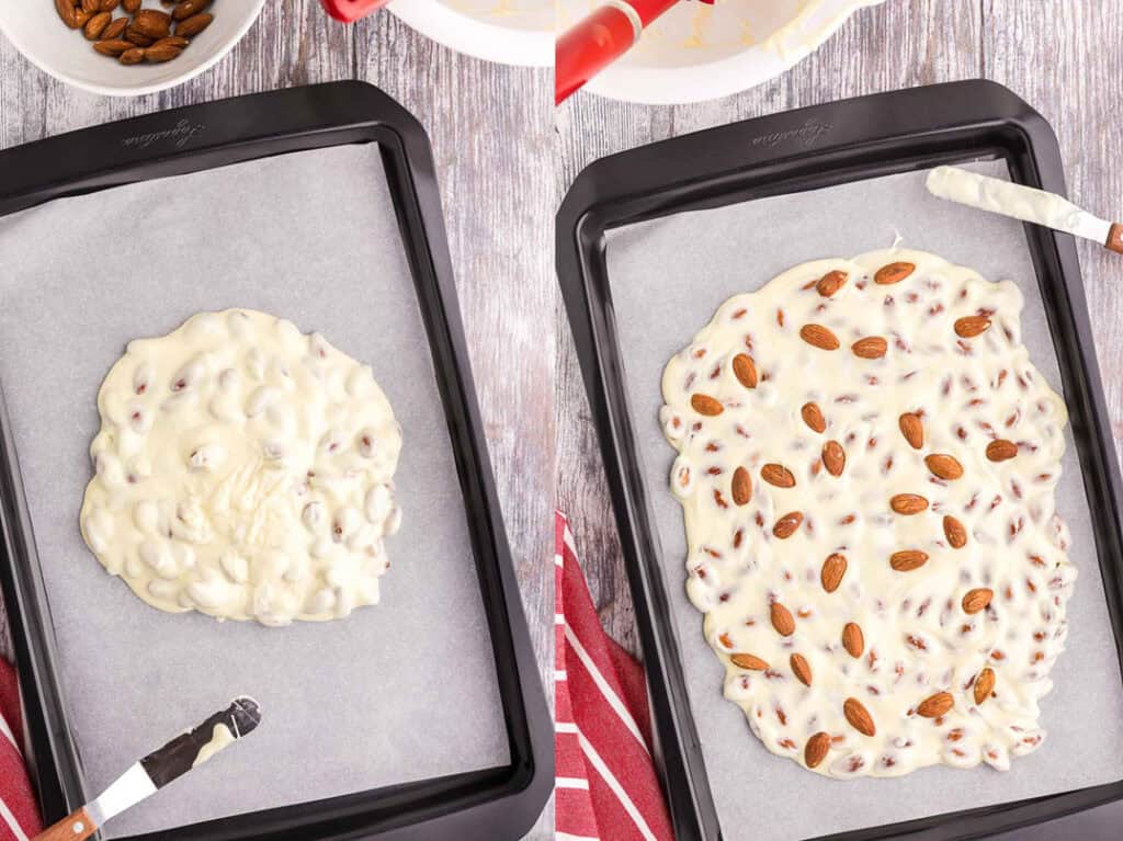 Two side by side overhead shots.  The picture on the left is of a parchment lined baking sheet where melted white chocolate and almonds has been poured into a pile in the middle of the tray.  The picture on the right is of the same white chocolate with almonds after it has been smoothed out with an offset spatula.  It's about 1/2" thick and has been sprinkled with toasted whole almonds.