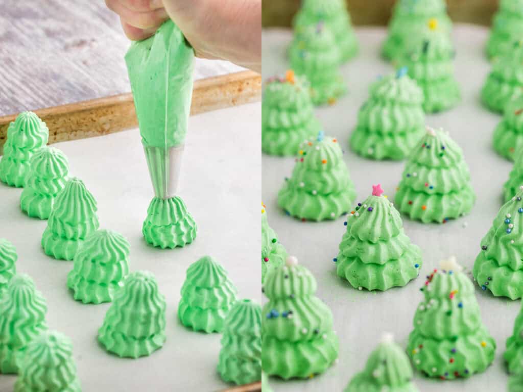 Two pictures side by side.  The picture on the left is a side shot of a Christmas Tree meringue being piped.  The piping bag is being held vertical and is piping the second layer onto the tree.  Other trees have already been piped on to the parchment lined baking sheet.  The picture on the right is a close up side shot looking through all the Christmas tree meringues on the baking sheet, they have been decorated with multicolored sprinkles and each has a candy star on top.