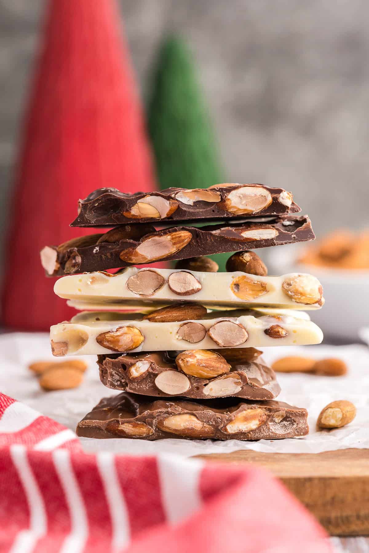 A stack of almond bark.  Individual pieces made from milk, white, or dark chocolate. 