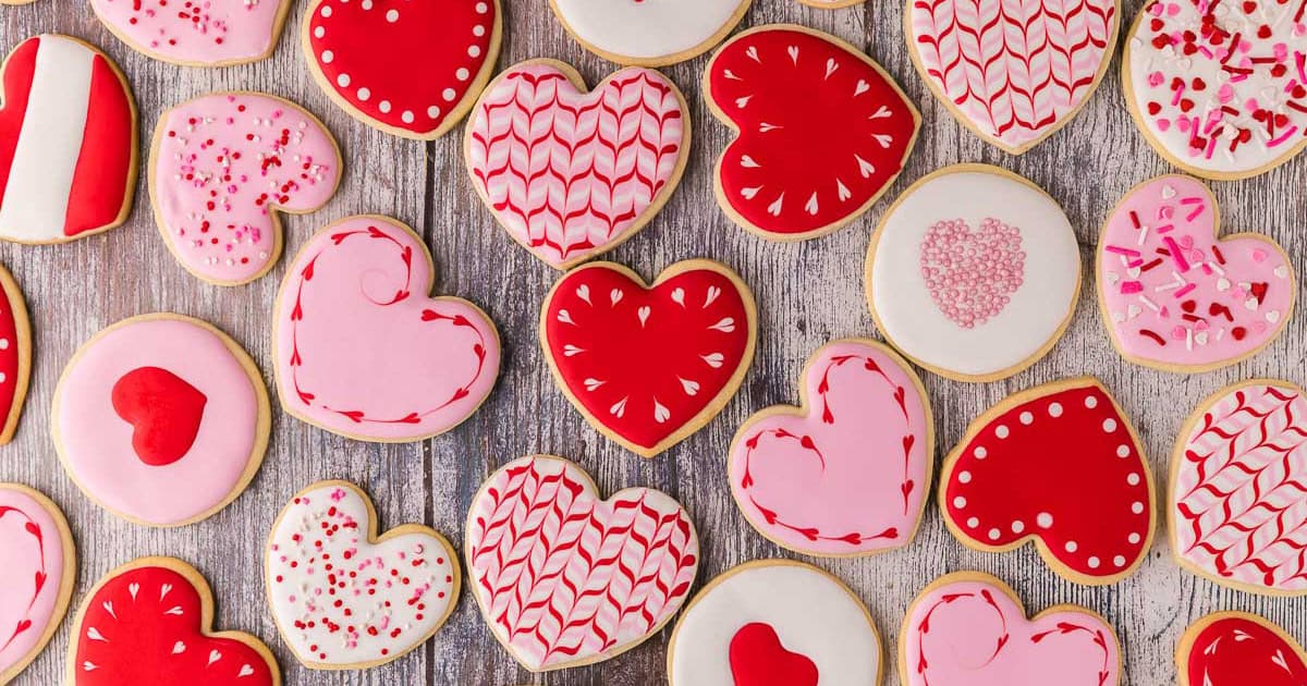 heart shaped sugar cookies decorated in royal icing for Valentine's Day