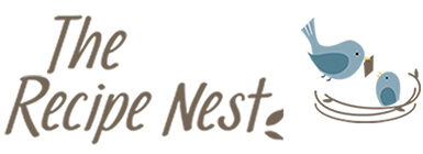 Logo for The Recipe Nest. A nest with a mama bird flying in to her baby bird.