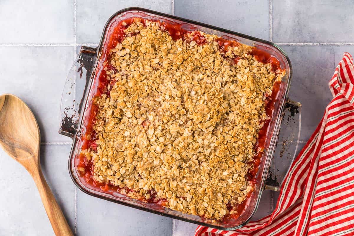 overhead shot the strawberry rhubarb crisp right after coming out of the oven. The filling is bubbling hot and the topping is a nice crispy golden brown.